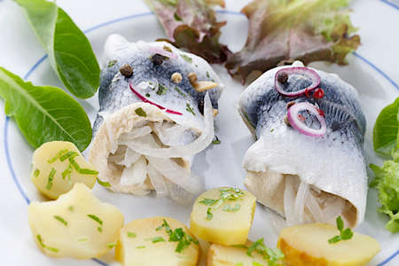 Fresh Rollmop herring with  potatoes saladの写真素材
