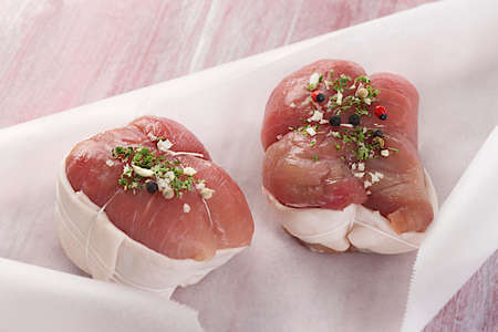 Veal roulade in backing paper ready to be cookedの写真素材