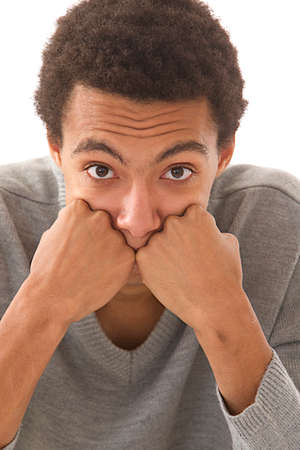 Portrait of a mulatto guy ,head in hand