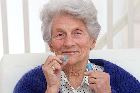 Senior Lady with homeopathic medicine 