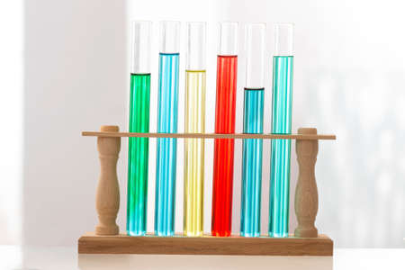 Set of test tubes with a colored liquids in a rack