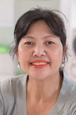 Smiling senior asian thai woman portraitの写真素材