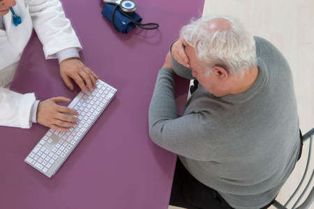 Depressed senior man visiting doctor