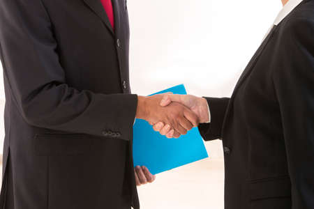 Close up of business people shaking hands
