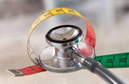 Measuring tape and stethoscopeの写真素材