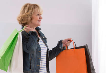 Senior on a shopping trip, eHappy  about her bargains