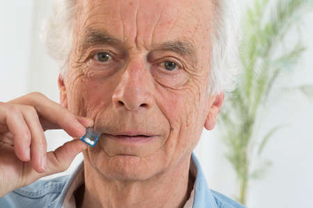 Senior man tacking  homeopathic medicine