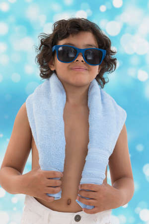 little boy blue backgroung, ready for sunbathesの写真素材