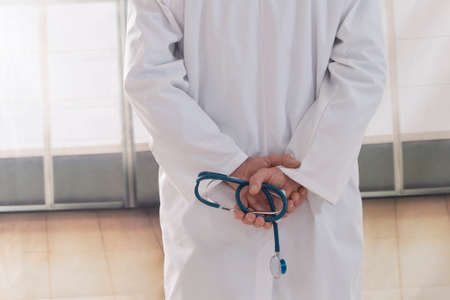 back view Doctor in lab coat with stethoscopeの写真素材