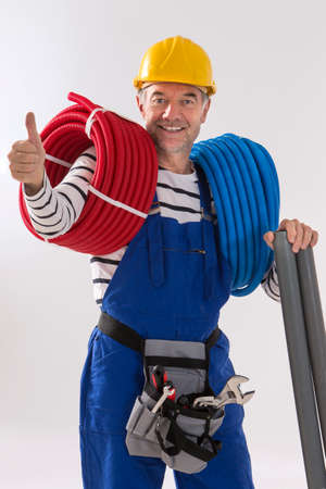 Electrician worker with tools on white background.