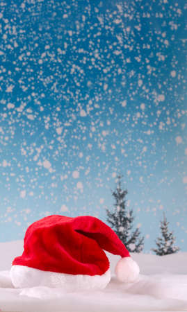 Santa hat  on snow backgroungの写真素材