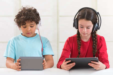 Children Playing With Digital Tablet