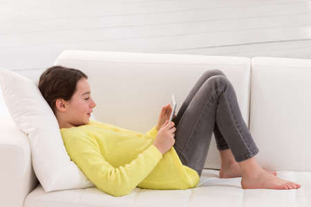 young  girl is reading a book