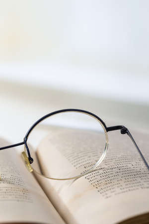 Old books with eye glasses  vintage styleの写真素材