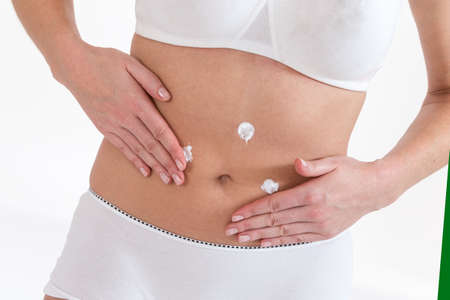 woman bodycare belly moisturizing traitementの写真素材