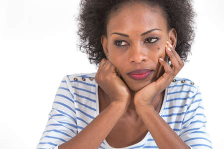 Beautiful black woman portrait - isolated over a whiteの写真素材