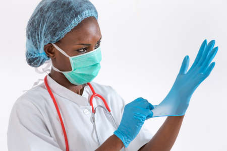 Portrait of african female doctor in mask. Close up shot.の写真素材