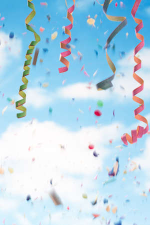 Streamers and confettion white and blue  backgroundの写真素材