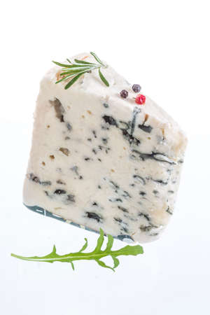 Slice of Roquefort traditional french  cheese on white backgroundの写真素材