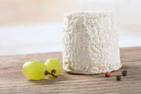 traditional french goats cheeses on white  background