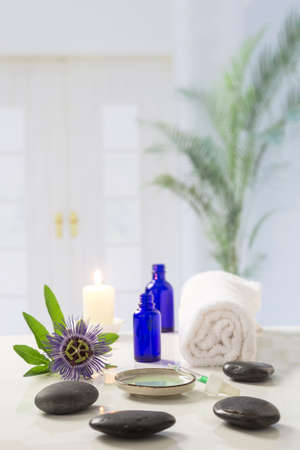 Aromatherapy candles burning and bath towels for a relaxationの写真素材