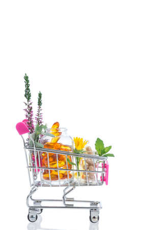 Shopping trolley with pills and medicine on white backgroundの写真素材