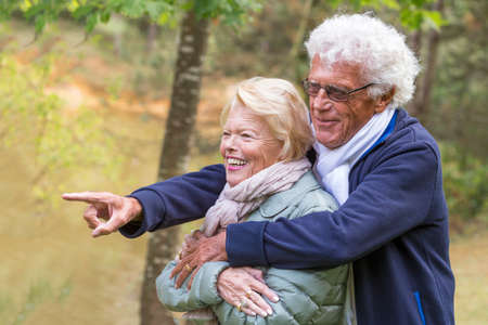 beautiful smiling senior couple enjoying life in countrysideの写真素材