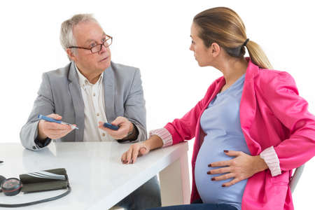 Diabetes Consult. Pregnant Woman at doctor officeの写真素材