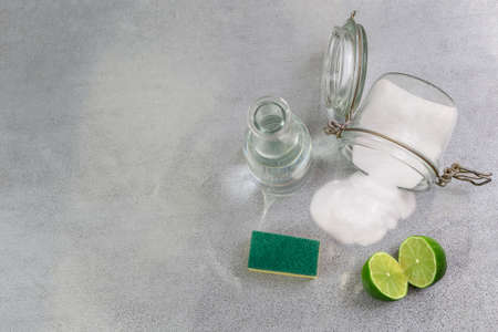 Eco-friendly natural cleaners cleaning products. Homemade green cleaning on grey background.