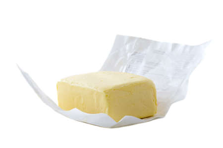Close up of open pack of margarine or vegetarian butter on white backgraund.の写真素材