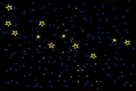 waterfalls of golden glitter s particles stars on black background,happy new year holiday concept