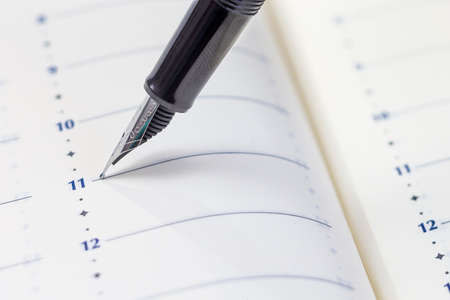 Pen on calendar page. ready to writte something on the plannerの写真素材
