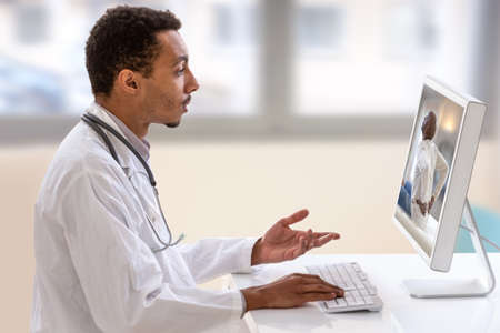Telemedicine or telehealth concept, Doctor with a stethoscope on the computer laptop screen.