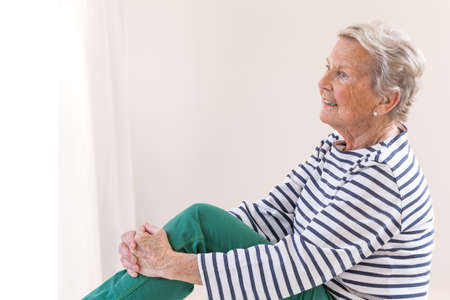 Portrait Of Smiling Senior Woman profile view