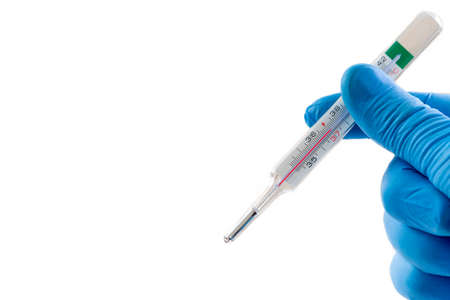 Doctorshand with blue latex gloves holds a thermometer with red mercury showing temperature on white...