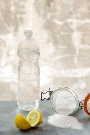 Lemon and sodium bicarbonate. Eco-friendly natural cleaners baking soda, lemon wooden tableの写真素材