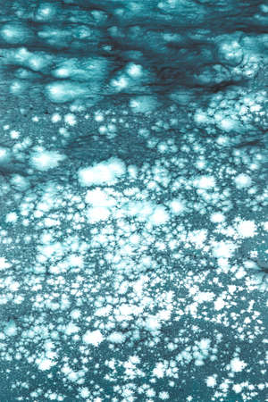 wooden board painted with Blur sea water on sunny day effect. Blue bokeh on water with blurred...