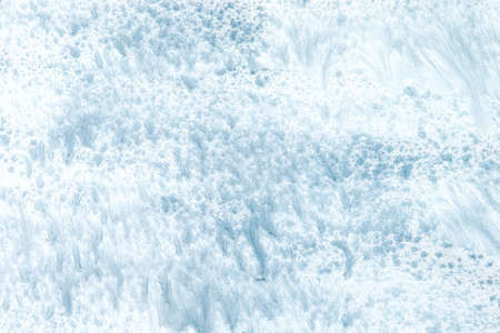 light blue acrylic painted wooden background.