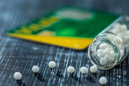 Concept of homeopathic pills and french health card, Reimbursement ort not.Still lifeの写真素材