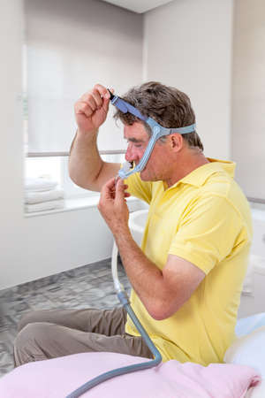 Man sleeping apnea and CPAP machine