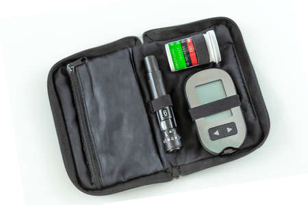 The blood glucose meter in bag isolated on white