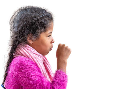 A young girl coughing, against a white background with copy space.の写真素材