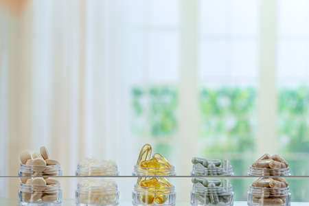 Bottle of pills food suplements healthy medicine medication health care treatment herbal medicineの写真素材