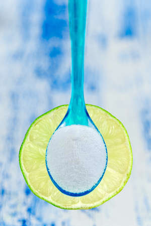 Baking soda sodium bicarbonate and lemon - Citrus latifolia,non toxic cleanerの写真素材