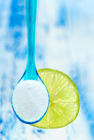 Baking soda sodium bicarbonate and lemon - Citrus latifolia,non toxic cleanerの写真素材