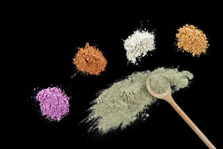 Various kinds of cosmetic clay red, yellow, pink , blue, orange, on ceramic litlle bowlの写真素材