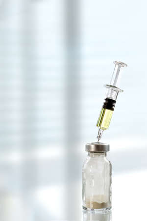 Medicine bottles glass and syringe injection needle on white background - Medication drug bottle equipment medical tool for nurse.の写真素材