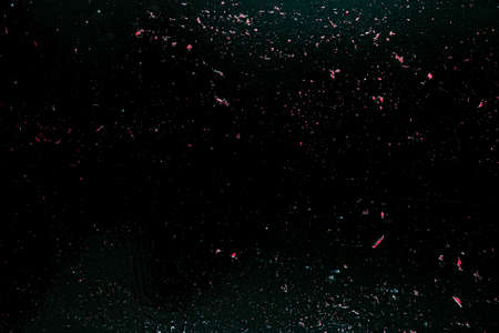 Red and black melted painted wooden board texture background.の写真素材