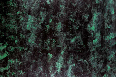 Dark green and black painted wooden background.の写真素材