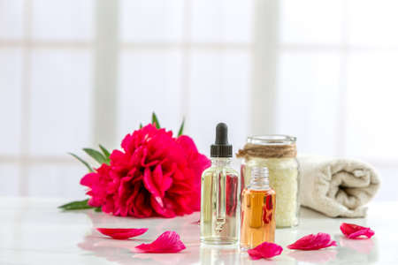 composition with cosmetic products, tubes and red peonies oの写真素材